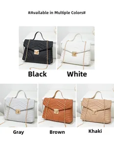 Detail view of quilted chain handbag available in black, white, grey, brown and khaki