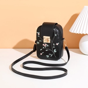 Close-up of black PU leather mobile bag featuring detailed floral embroidery and gold lock