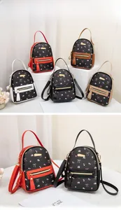 Detailed display of mini floral bow backpacks in five colors with adjustable straps