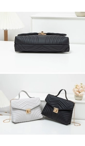 Detailed view of quilted leather flap bags with gold hardware and chain straps