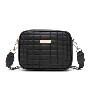 Black quilted crossbody bag with stylish wide woven strap and gold metal detail