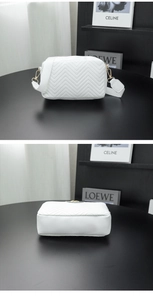 Detail showing white chevron quilted PU leather and gold hardware on crossbody bag