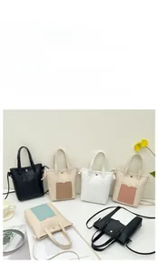 Détail de sacs fourre-tout rectangulaires minimalistes en plusieurs couleurs sur fond lifestyle