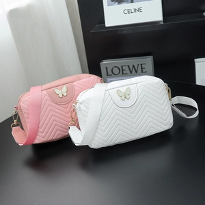 Fashionable wave-quilted camera bags in pink and white with metal butterfly detail