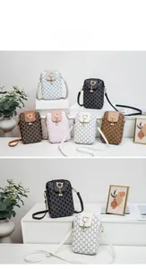 Detail of vintage patterned phone bags with golden cat clasp and pearl tassel pendants