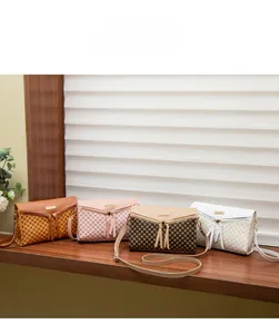 Detail view of four fashion crossbody bags in caramel, pink, and plaid patterns with gold buckles