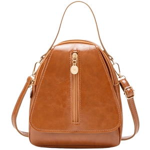 Brown oil wax leather lady backpack with gold vertical zipper and top handle design