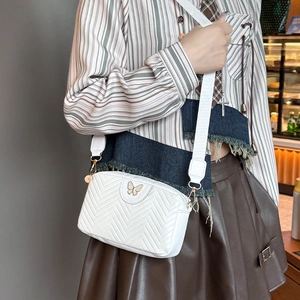 White wave quilted camera bag for women featuring golden butterfly and wide strap