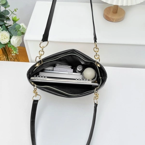 Large capacity woven tote bag with chain strap showing interior storage and tablet