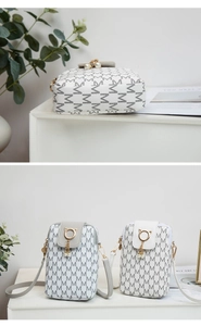 Detail of mini crossbody phone bags with M-pattern print, pearl charm, and cat-ear metal ring