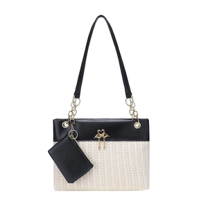 Large woven tote bag set in beige and black leather with golden swan charm and chain strap