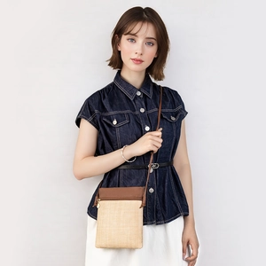Fashionable straw woven mini crossbody bag with brown leather flap for women beach style