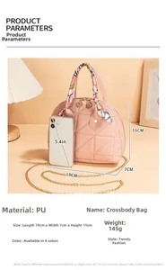 Detailed view of pink quilted shell bag with silk scarf handle and golden chain strap