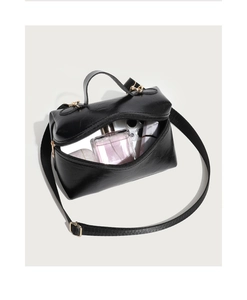 Top view of a black wax leather handbag showing spacious interior for essentials