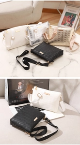 Detail of woven lattice pattern shoulder bags with gold metal hardware and fabric strap