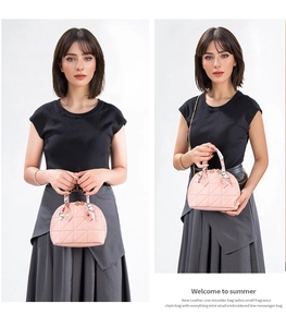 Detail of pink quilted shell bag featuring silk scarf handle and golden chain strap