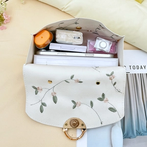 Embroidered pearl handbag with rose patterns and spacious interior for daily items