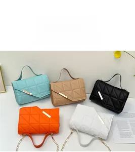 Five quilted crossbody bags in mint, khaki, black, orange, and white with metal trim