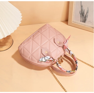 Pink quilted shell handbag with elegant floral scarf-wrapped handle and gold chain strap