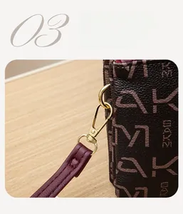 Detail of lychee pattern leather bag with monogram and adjustable burgundy shoulder strap