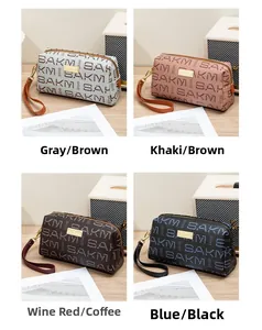 Detailed grid view showing four large makeup bags with SAKM letter print and metal logo