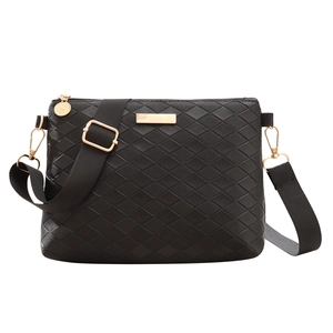 Classic black quilted crossbody bag with adjustable wide shoulder strap and gold hardware