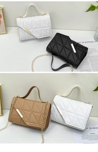 Close-up of diamond quilted texture and gold metal chain strap on minimalist bag