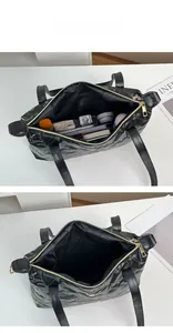 Detail view of large capacity interior for black tote bag with floral embroidery