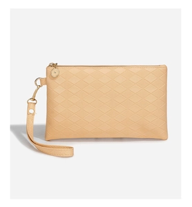 Detail of small beige card bag featuring quilted pattern and golden metal zipper hardware