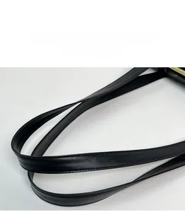 Detail of comfortable black faux leather handles with durable double stitching on bag