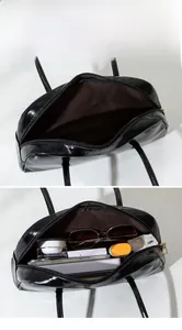 Détail montrant le rangement interne d'un grand sac baguette noir brillant avec accessoires