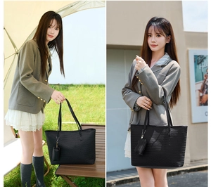 Detail of black woven tote bag with a small matching pouch in an outdoor setting