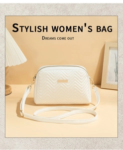 Detail of white V-quilted crossbody bag featuring gold hardware and elegant metal plate