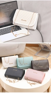 Close-up of printed small flap bags with golden chains in various color options