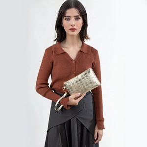 Elegant gold quilted clutch bag with metallic finish and wristlet strap for women