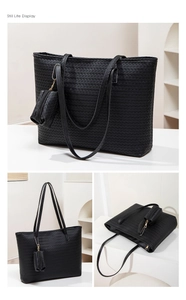 Detailed close-up showing black woven texture tote bag and small matching coin purse