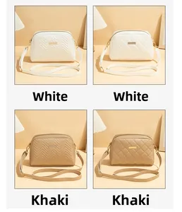 Detailed comparison of chevron and diamond quilted crossbody bags in white and khaki