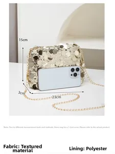 Detailed view of gold sequin evening clutch bag showing 23x15x3cm dimensions with a phone