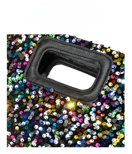 Detail of colorful sequins and premium black leather handle on the square handbag
