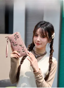 Pink faux leather long wallet with floral embroidery and detachable wrist strap