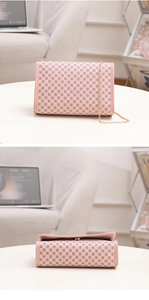 Detail view of pink flap crossbody bag with vintage circular print and gold chain