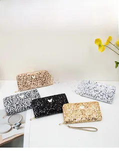 Long sequined wallets in multiple colors with butterfly accents and wrist straps