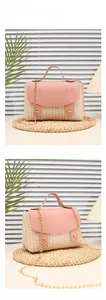 Detail of pink woven straw handbag with gold clasp and detachable chain strap