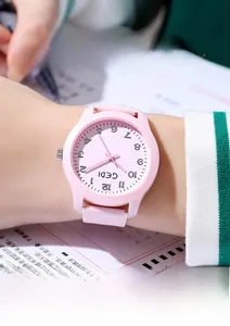 Detailed view of GEDI silent quartz watch for students with pink silicone strap and numbers