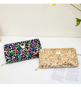 Long sequin wallets with butterfly detail and gold zipper on white background