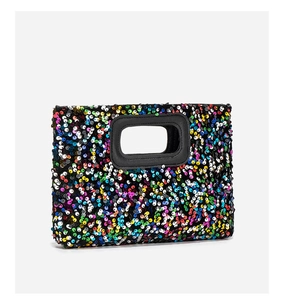 Close-up of colorful sequins and black leather trim on a rectangle party clutch bag