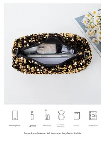 Detail view of the black sequin bag showing its capacity for makeup and essentials