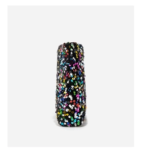 Macro rear view of fashion boots with colorful sequins and vibrant contrast stitching