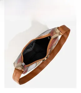 Internal view of color-block underarm bag showing spacious storage and animal texture