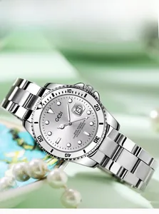 Macro shot of a stainless steel watch with 3D dial and rotatable bezel detail